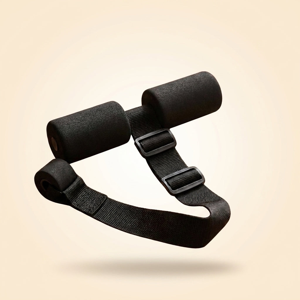 A black adjustable strap with two cylindrical foam padding sections and plastic buckles, shown floating against a warm beige gradient background.