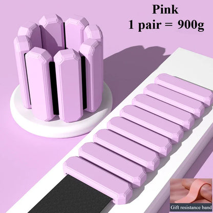 Pink resistance bands with a holder on a light purple background